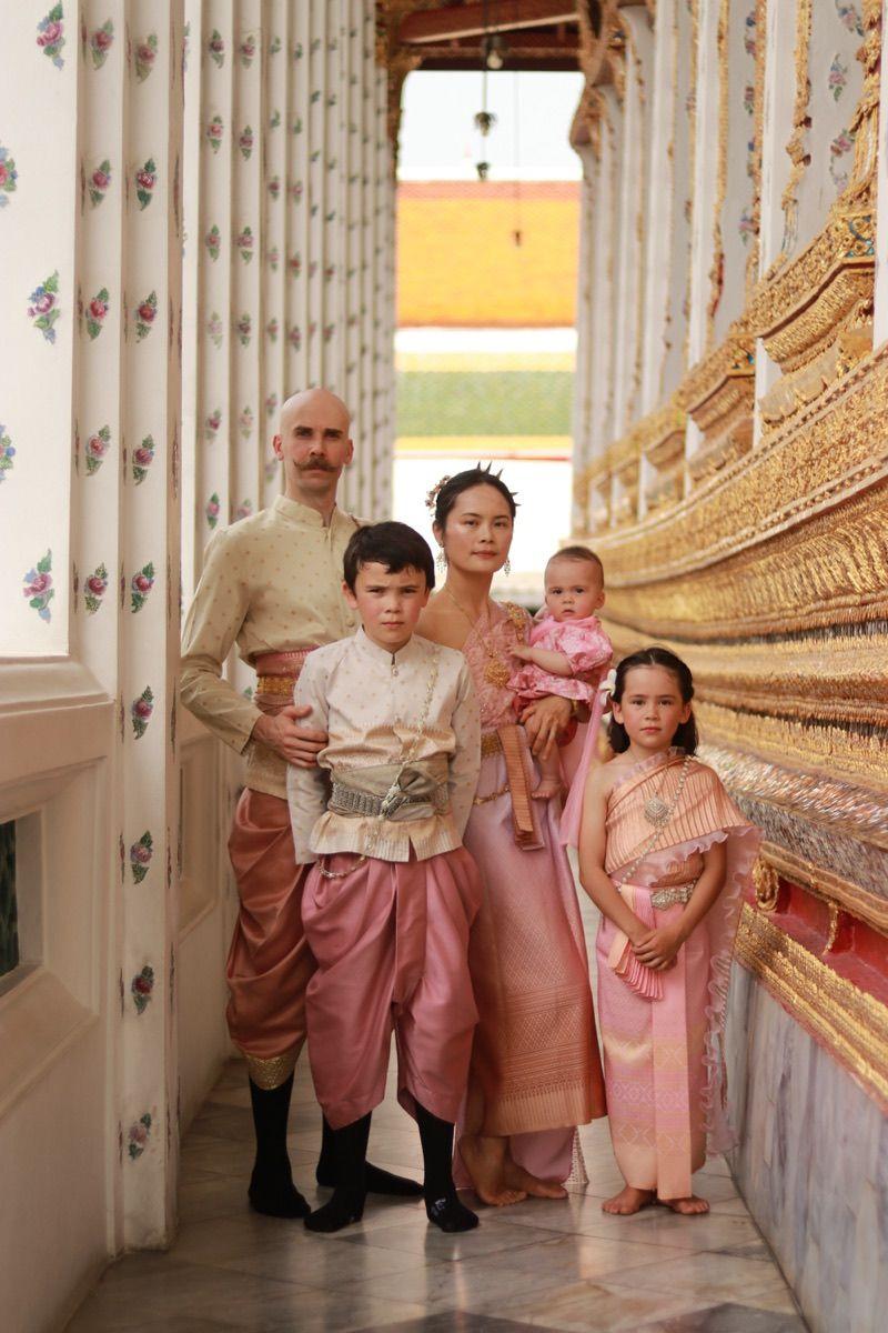 The founding family in traditional Thai dress at a temple, on Mother's Day.