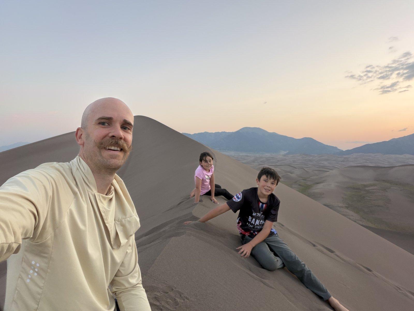Great Sand Dunes — the family on the dunefield at dusk.